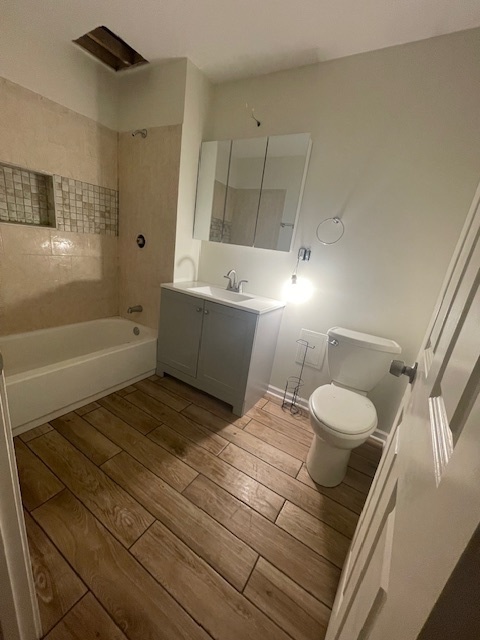 2620 West 24th Street Chicago, IL 60608 - Photo 20 of 25 a bathroom with a sink and mirror