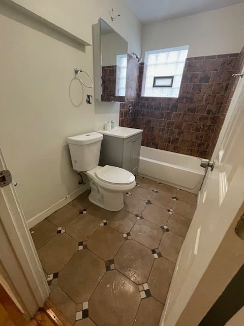 2620 West 24th Street Chicago, IL 60608 - Photo 23 of 25 a bathroom with a toilet sink and mirror