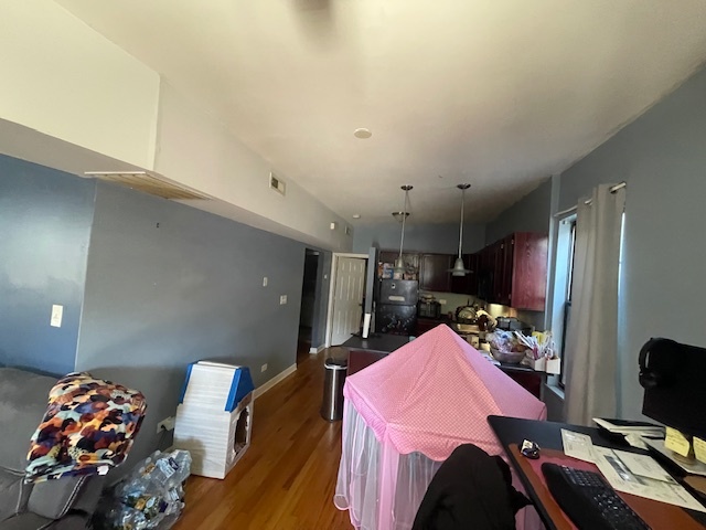 2620 West 24th Street Chicago, IL 60608 - Photo 5 of 25 a bed room with a bed mirror and a television