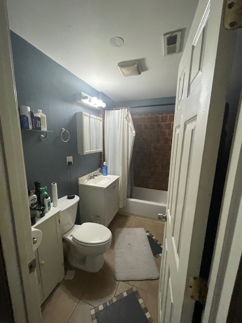 2620 West 24th Street Chicago, IL 60608 - Photo 9 of 25 a bathroom with a toilet and a shower