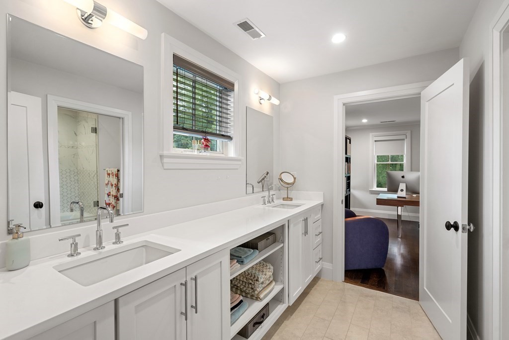 76 Paulson Road Newton, MA 02468 - Photo 29 of 41 a spacious bathroom with a double vanity sink a mirror and next