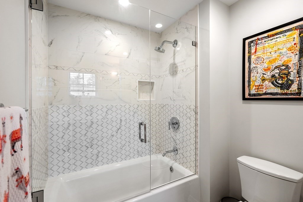 76 Paulson Road Newton, MA 02468 - Photo 30 of 41 a bathroom with a bathtub a toilet and a shower