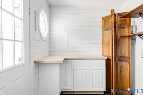 a bathroom with a shower and a sink