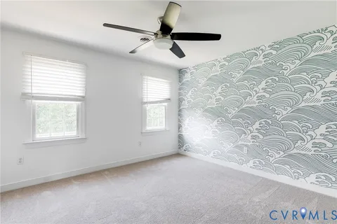 a view of empty room with windows