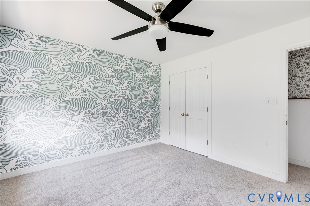 16044 Parsons Road Beaverdam, VA 23015 - Photo 25 of 44 an empty room with a ceiling fan and a window