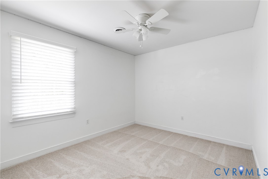 16044 Parsons Road Beaverdam, VA 23015 - Photo 27 of 44 an empty room with a window and a fan