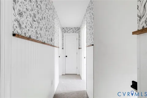 a view of a hallway with closet