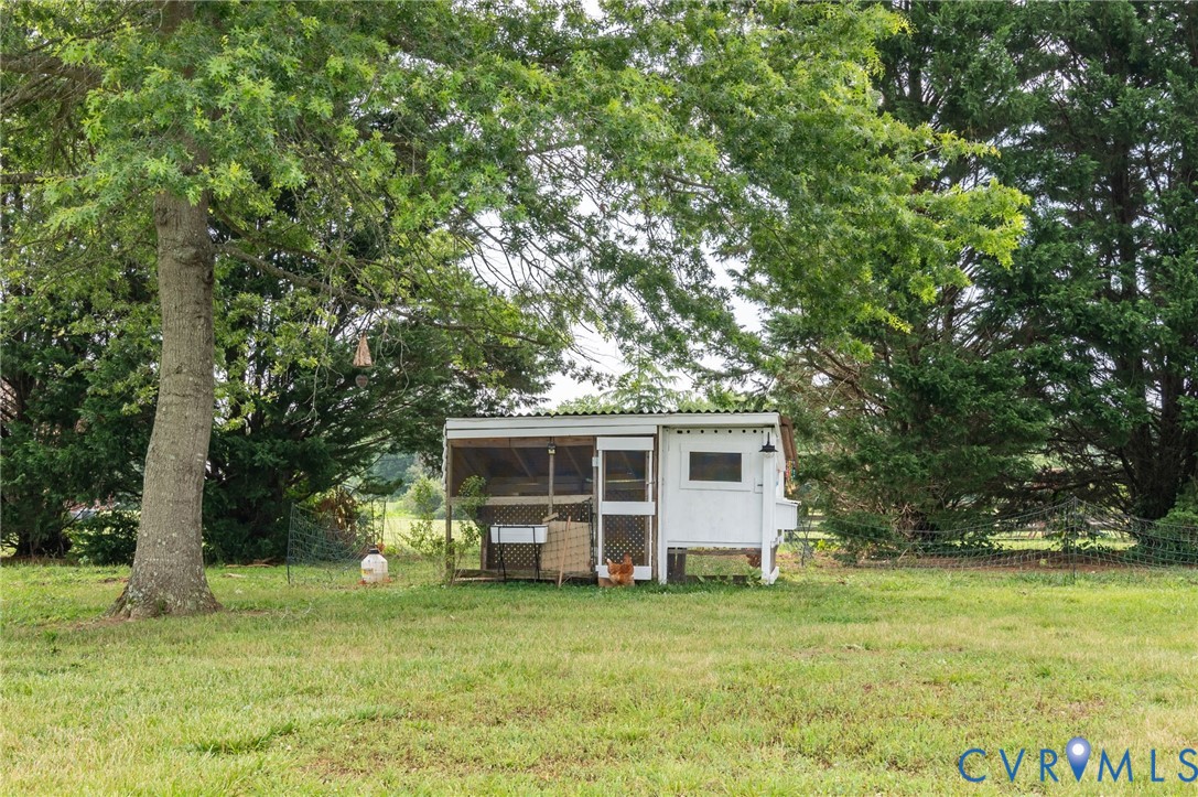 16044 Parsons Road Beaverdam, VA 23015 - Photo 33 of 44 a view of a house with a backyard