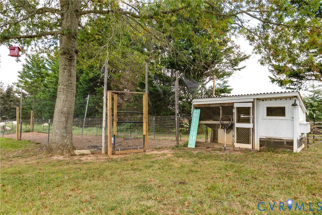 16044 Parsons Road Beaverdam, VA 23015 - Photo 34 of 44 a view of a house with backyard and a tree