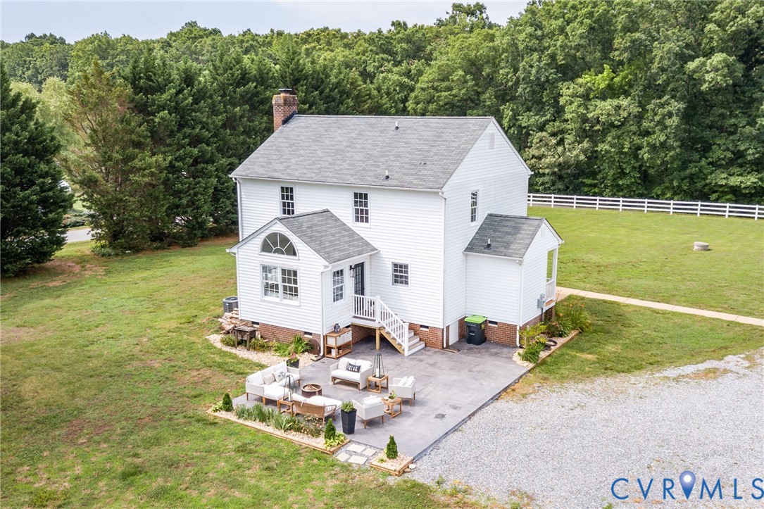16044 Parsons Road Beaverdam, VA 23015 - Photo 43 of 44 a aerial view of a house with a yard table and chairs