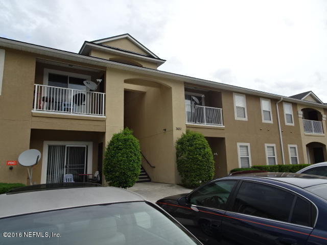 3631 Kirkpatrick Circle, Unit 6 Jacksonville, FL 32210 - Photo 1 of 14 a front view of a house with garden
