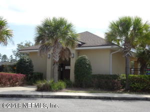 3631 Kirkpatrick Circle, Unit 6 Jacksonville, FL 32210 - Photo 12 of 14 a front view of a house with a garden