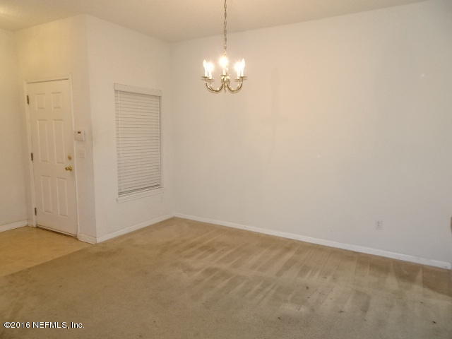 3631 Kirkpatrick Circle, Unit 6 Jacksonville, FL 32210 - Photo 4 of 14 a view of an empty room with chandelier fan