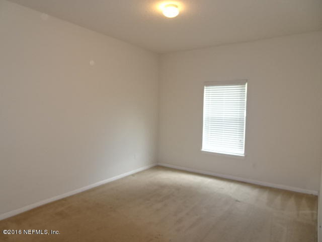 3631 Kirkpatrick Circle, Unit 6 Jacksonville, FL 32210 - Photo 5 of 14 an empty room with a window