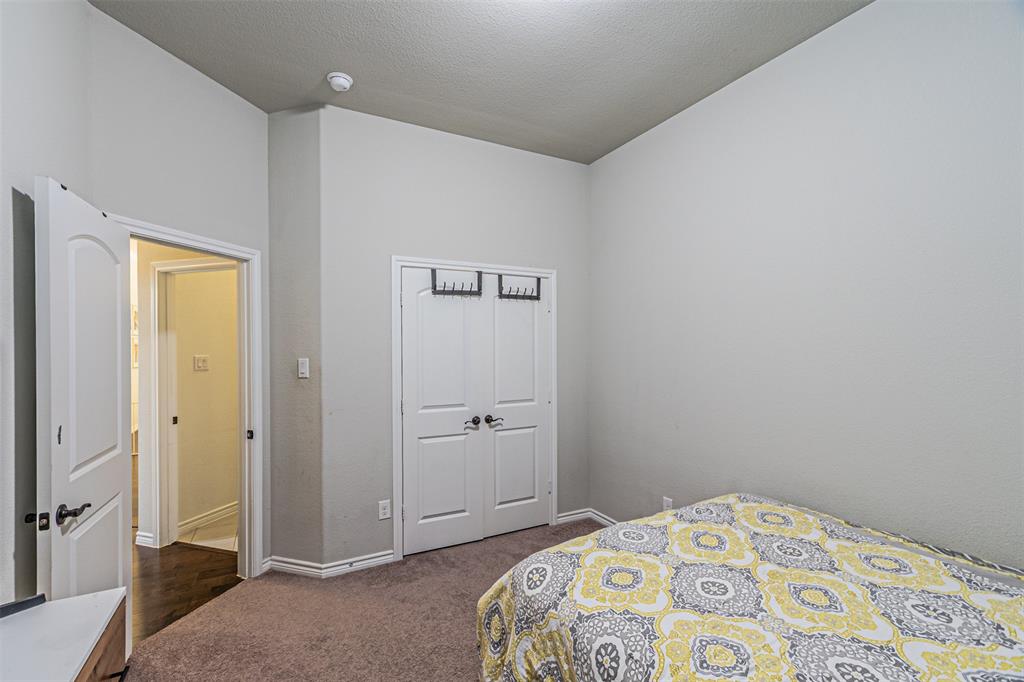 7201 Windy Ridge Drive Fort Worth, TX 76123 - Photo 14 of 36 a bedroom with a bed and a window