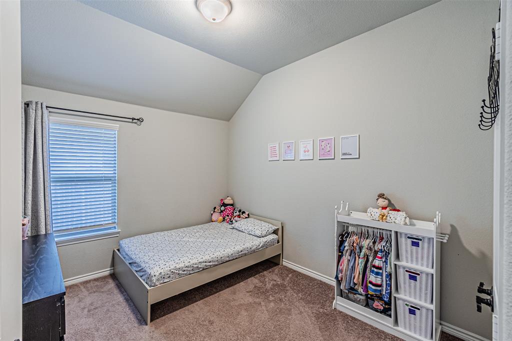 7201 Windy Ridge Drive Fort Worth, TX 76123 - Photo 15 of 36 a bedroom with a bed and a window