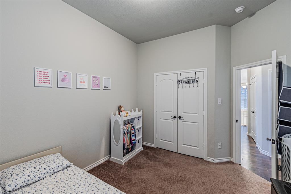 7201 Windy Ridge Drive Fort Worth, TX 76123 - Photo 16 of 36 a view of livingroom with hardwood floor and hallway