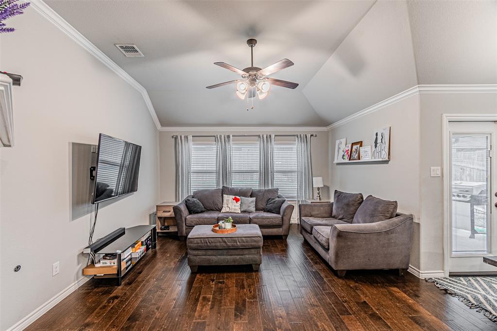 7201 Windy Ridge Drive Fort Worth, TX 76123 - Photo 24 of 36 a living room with furniture and a flat screen tv