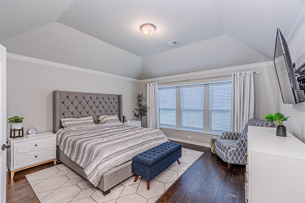 7201 Windy Ridge Drive Fort Worth, TX 76123 - Photo 26 of 36 a bedroom with a bed and a couch