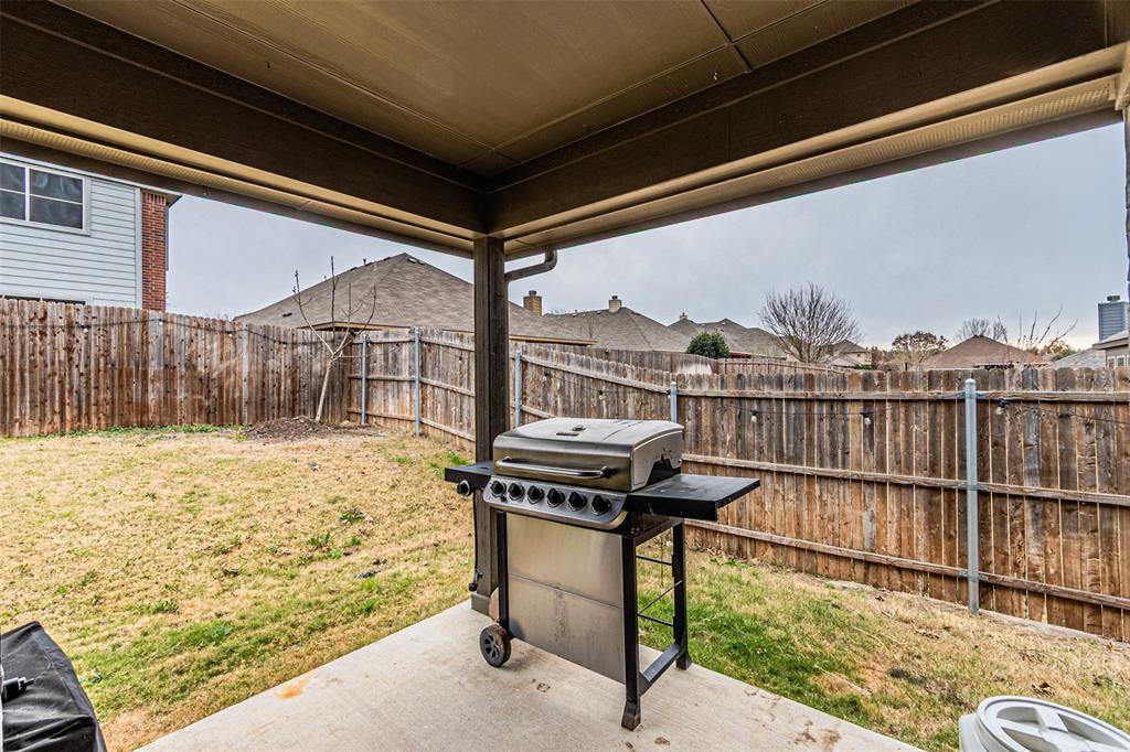 7201 Windy Ridge Drive Fort Worth, TX 76123 - Photo 30 of 36 a view of a balcony with a floor to ceiling window next to a yard