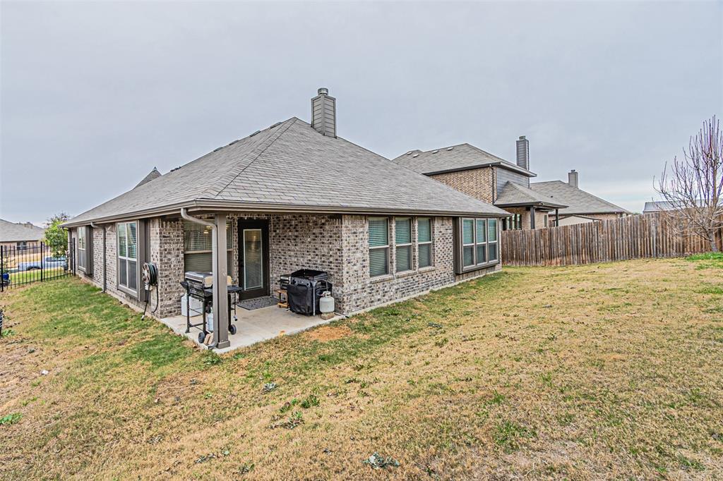 7201 Windy Ridge Drive Fort Worth, TX 76123 - Photo 33 of 36 a house with large trees in the background