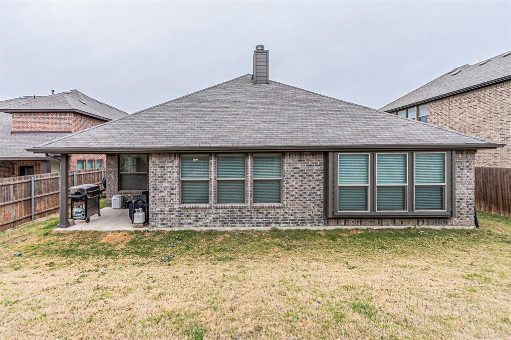 7201 Windy Ridge Drive Fort Worth, TX 76123 - Photo 34 of 36 a front view of a house with swimming pool and porch