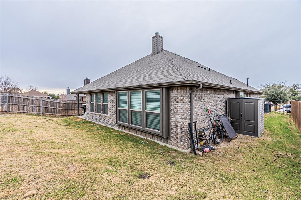7201 Windy Ridge Drive Fort Worth, TX 76123 - Photo 35 of 36 a view of a house with a yard