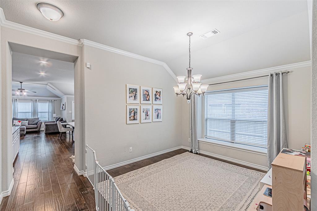 7201 Windy Ridge Drive Fort Worth, TX 76123 - Photo 8 of 36 a view of livingroom with hardwood floor and a ceiling fan