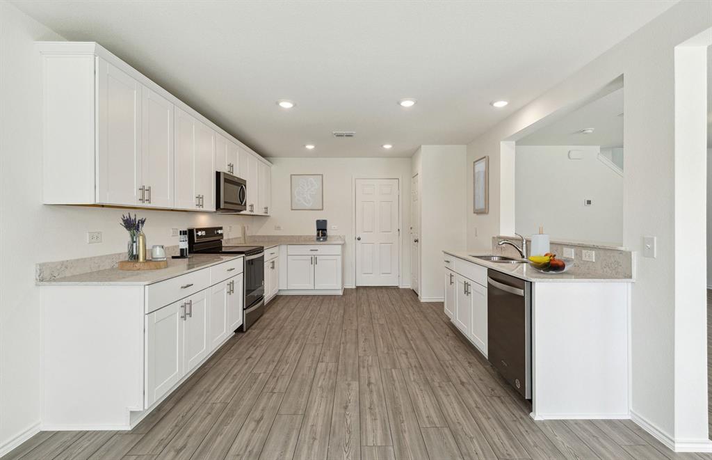 2305 Bay Laurel Lane Forney, TX 75126 - Photo 6 of 9 a view of kitchen with wooden floor