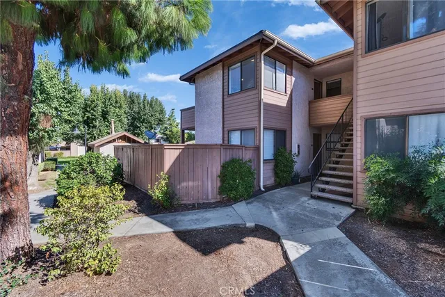 an aerial view of multiple houses with yard