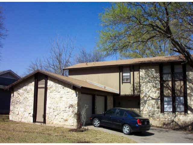 a car parked in front of a house