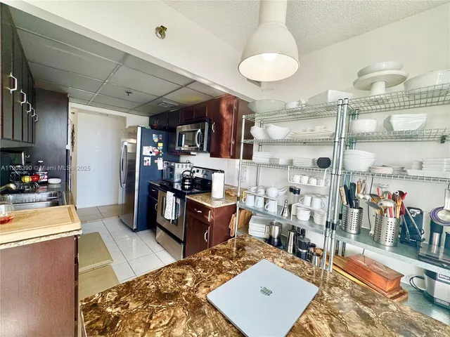 a en suite bathroom with a sink mirror and shower