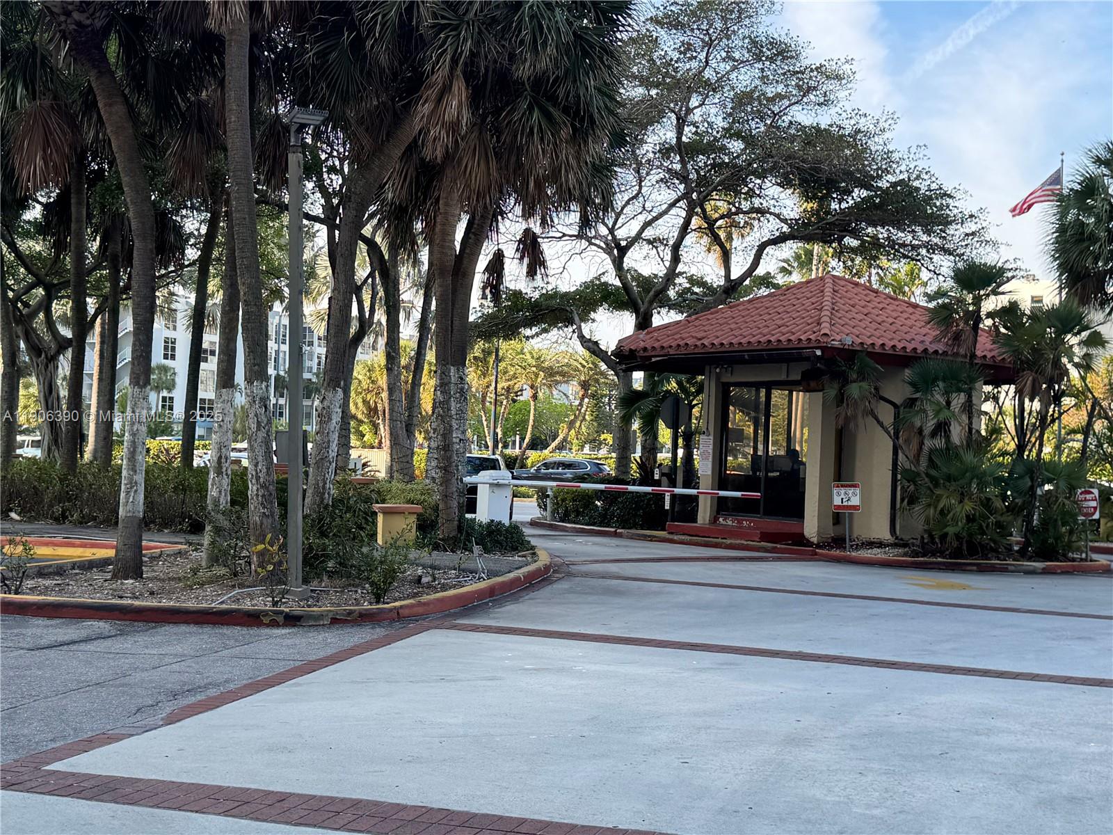 210 174th Street, Unit 1002 Sunny Isles Beach, FL 33160 - Photo 30 of 34 a view of a park with tree s