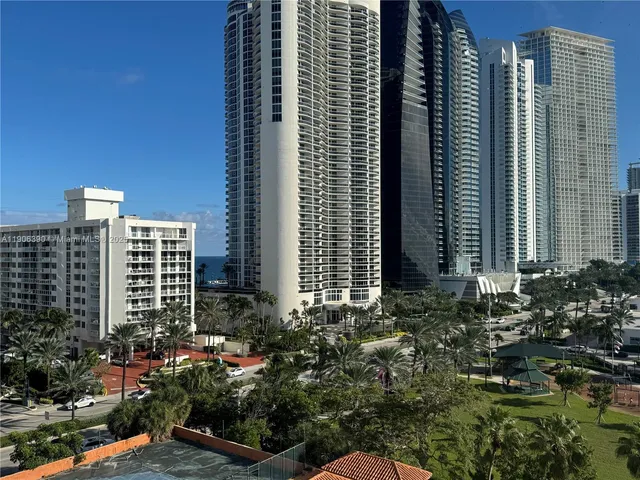 a view of staircase with railing and white walls