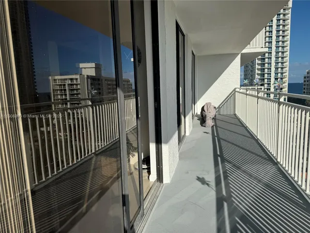 a living room with furniture a air conditioner vent and a window