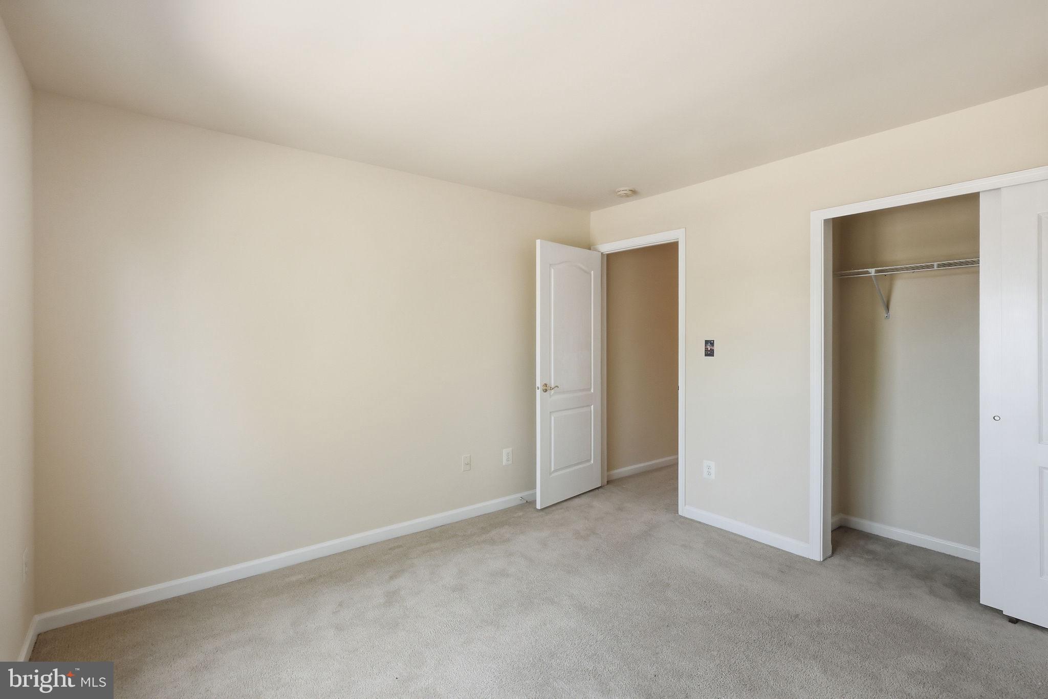 19617 Edgemont Square Ashburn, VA 20147 - Photo 39 of 65 an empty room with closet area