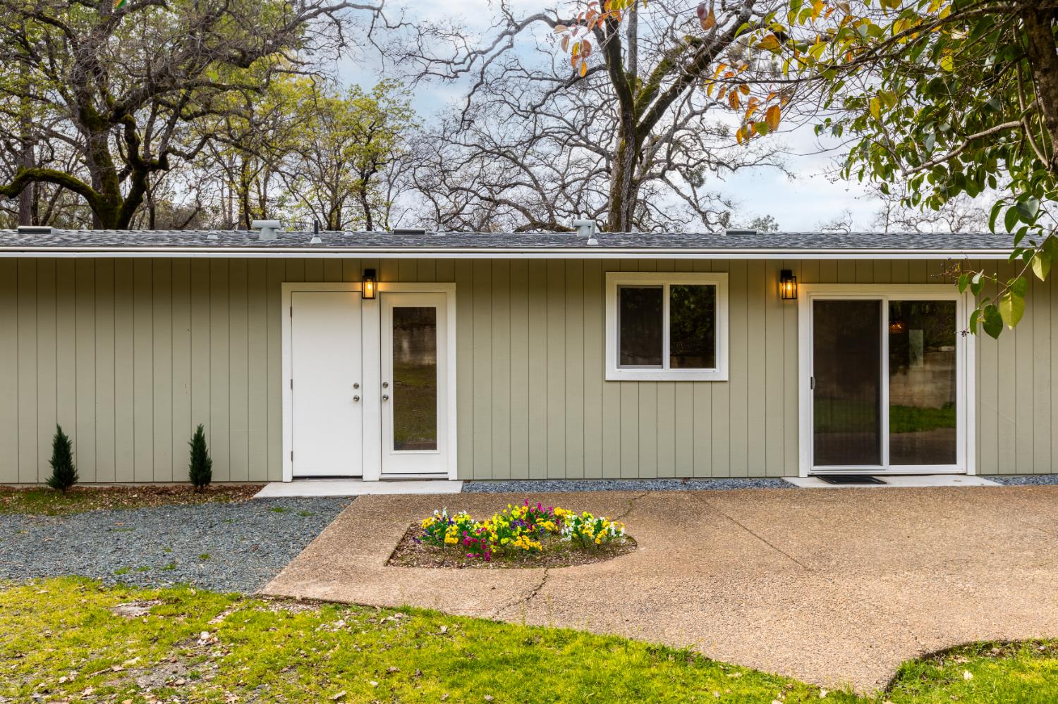16098 Wild Oak Ranch Road Grass Valley, CA 95949 - Photo 15 of 45 a front view of a house with lots of green space