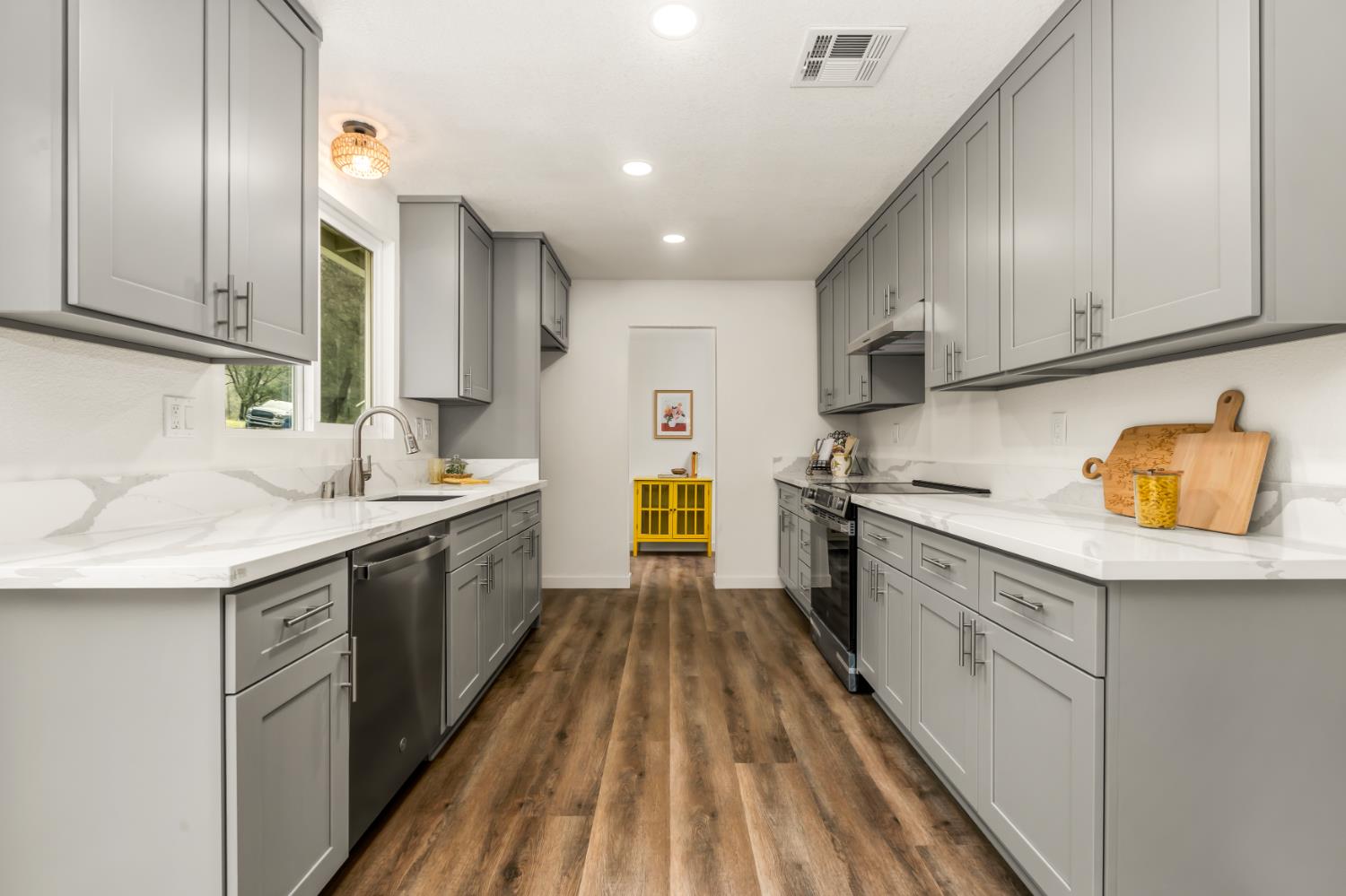 16098 Wild Oak Ranch Road Grass Valley, CA 95949 - Photo 16 of 45 a kitchen with a sink a counter top space stainless steel appliances and cabinets