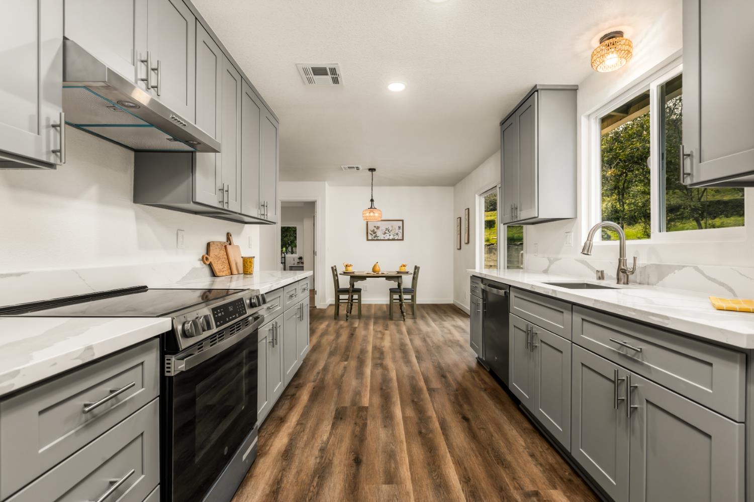 16098 Wild Oak Ranch Road Grass Valley, CA 95949 - Photo 20 of 45 a kitchen with granite countertop lots of counter top space and stainless steel appliances