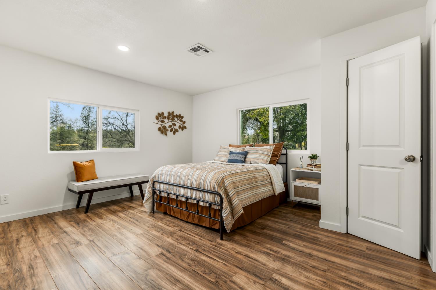 16098 Wild Oak Ranch Road Grass Valley, CA 95949 - Photo 21 of 45 a spacious bedroom with a bed and a window