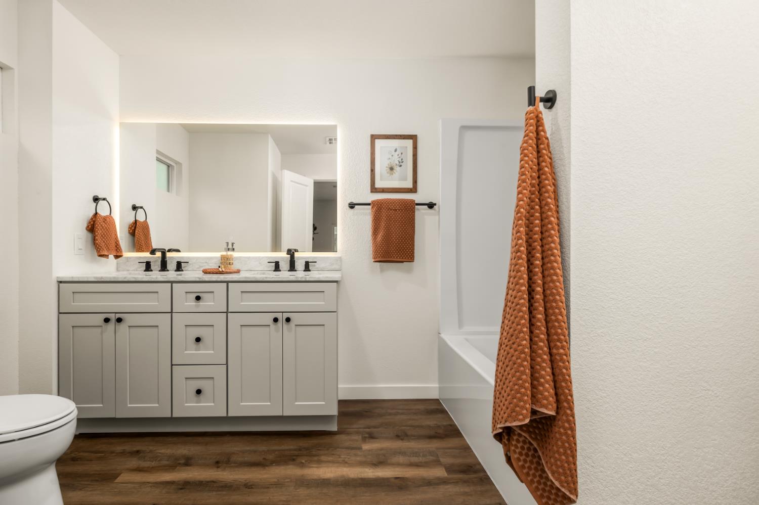 16098 Wild Oak Ranch Road Grass Valley, CA 95949 - Photo 23 of 45 a spacious bathroom with a double vanity sink and a mirror