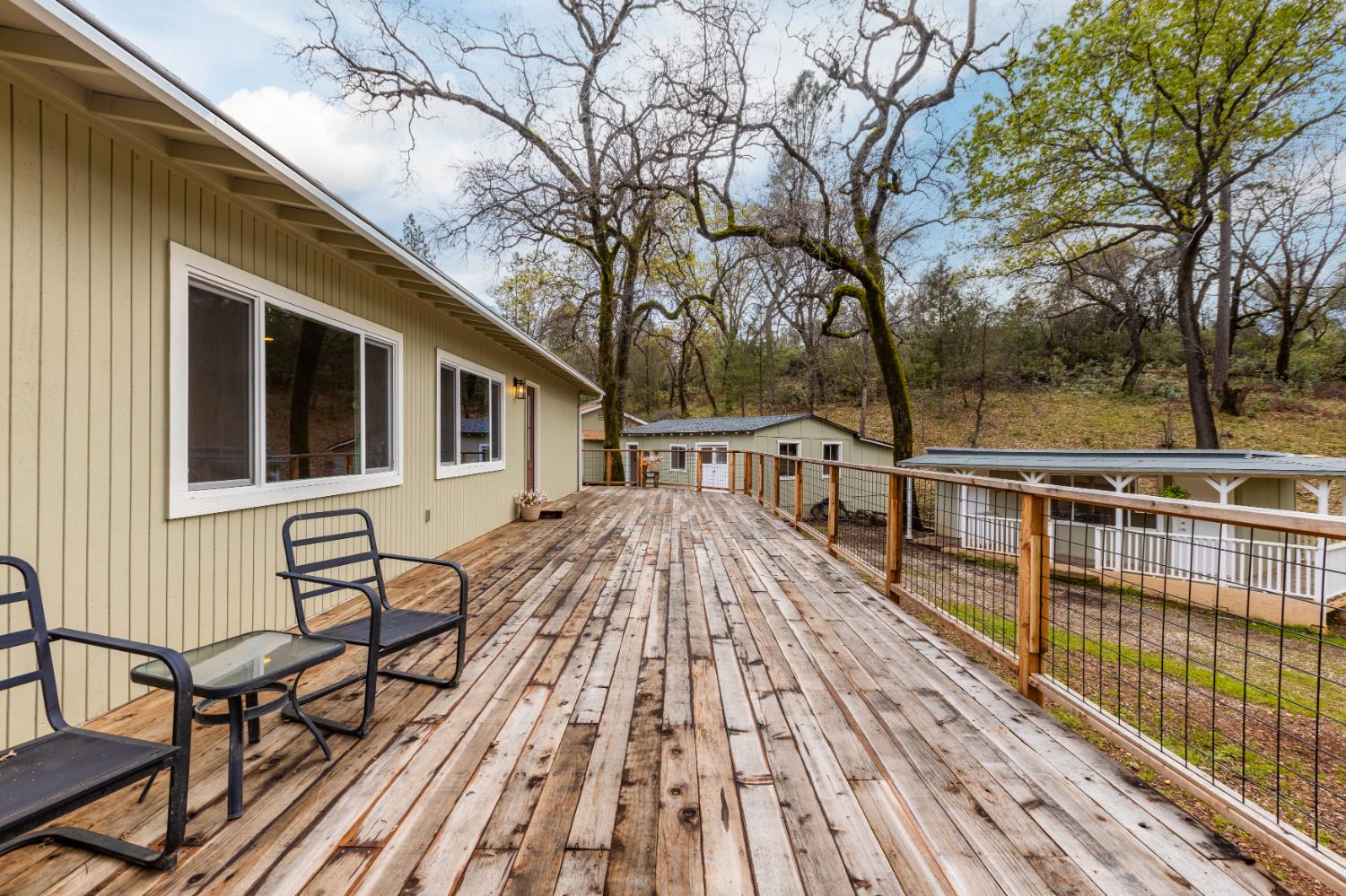 16098 Wild Oak Ranch Road Grass Valley, CA 95949 - Photo 29 of 45 a view of a house with backyard and sitting area