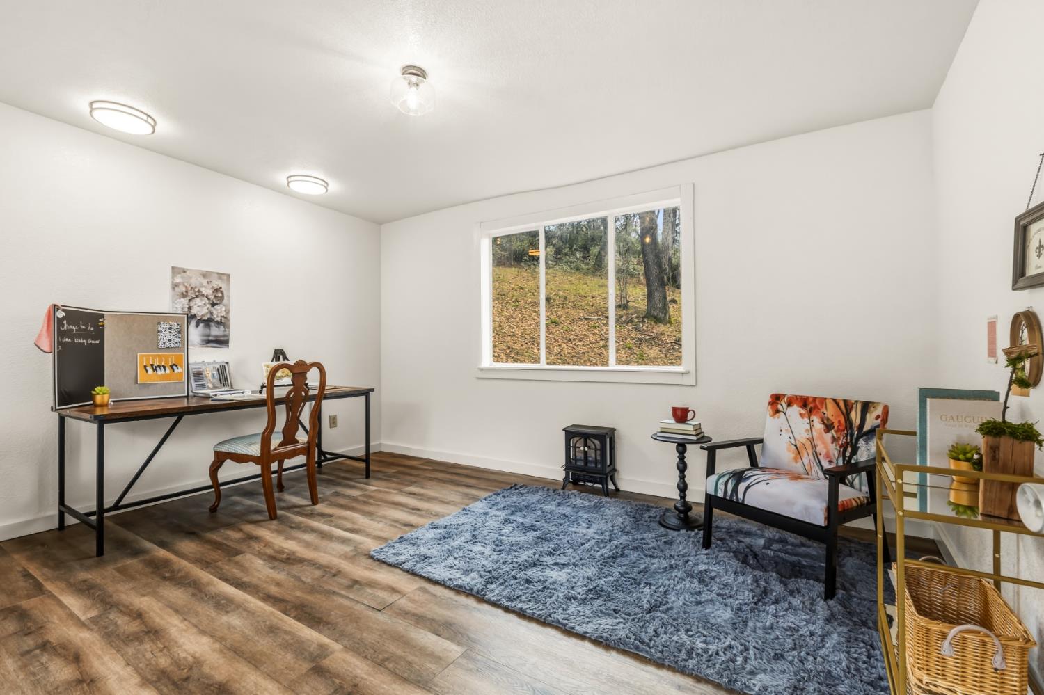 16098 Wild Oak Ranch Road Grass Valley, CA 95949 - Photo 31 of 45 a living room with furniture a window and a table