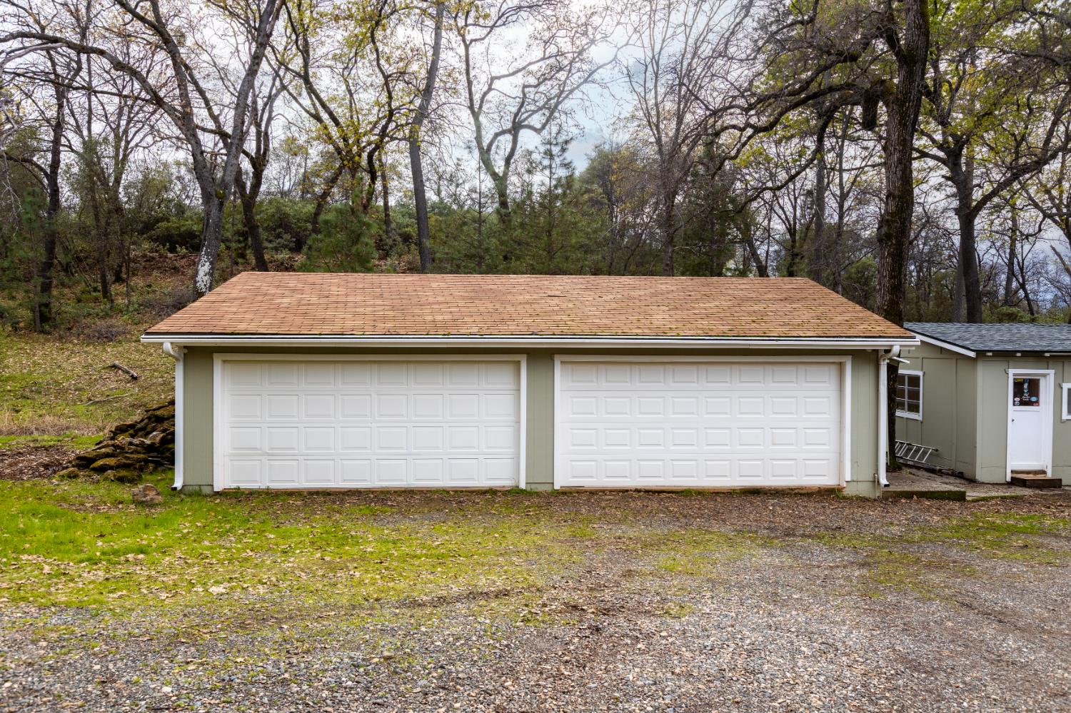 16098 Wild Oak Ranch Road Grass Valley, CA 95949 - Photo 37 of 45 a front view of house with yard and trees in the background