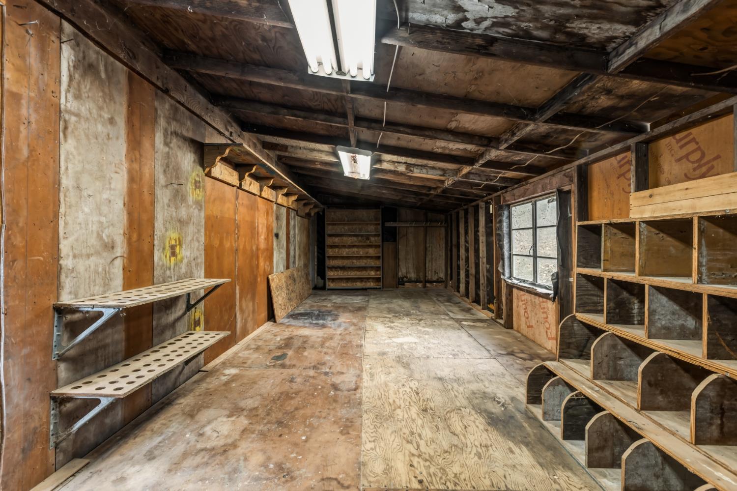 16098 Wild Oak Ranch Road Grass Valley, CA 95949 - Photo 38 of 45 a view of an empty room with wooden floor and windows