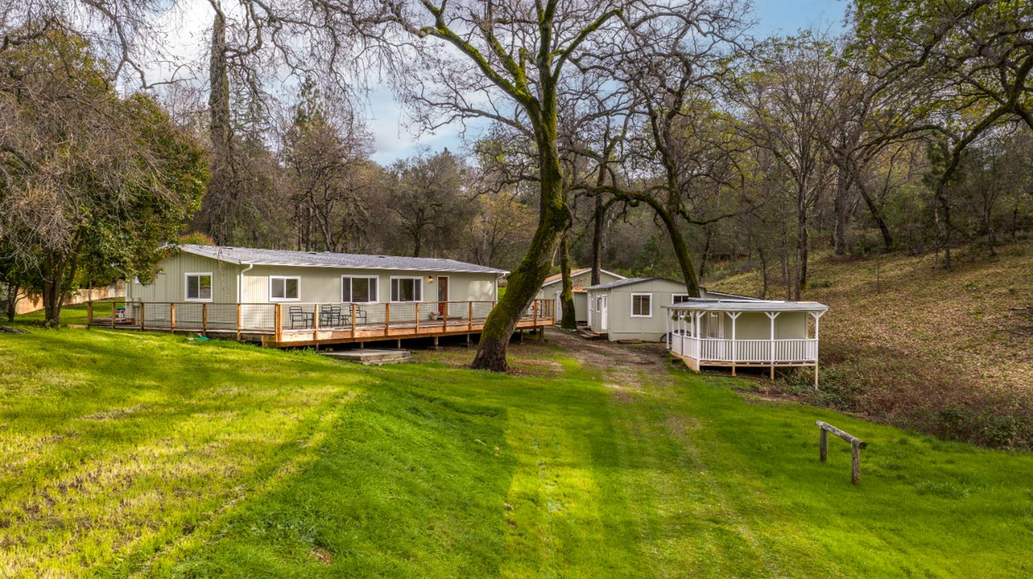 16098 Wild Oak Ranch Road Grass Valley, CA 95949 - Photo 44 of 45 a view of a house with backyard and sitting area