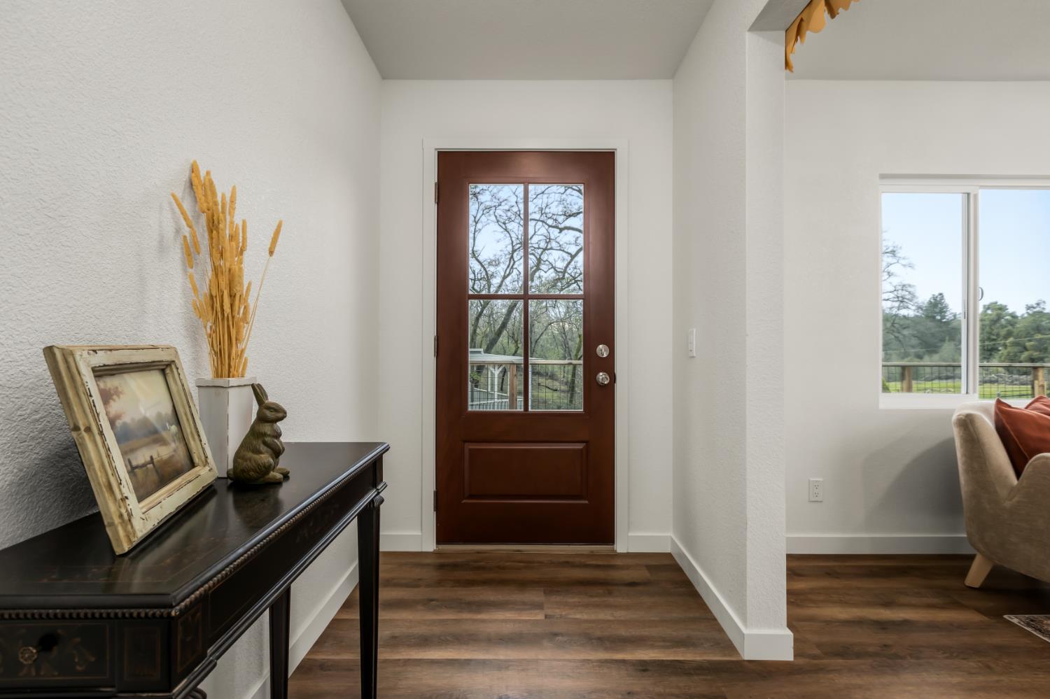 16098 Wild Oak Ranch Road Grass Valley, CA 95949 - Photo 10 of 45 a view of a workspace with furniture and a window