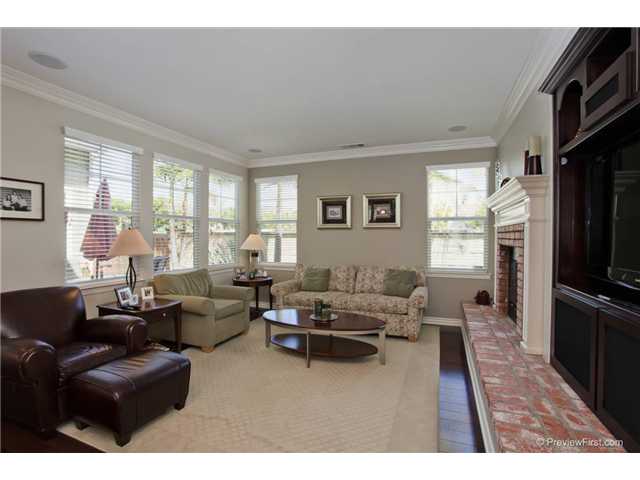 2681 Paradise Road Carlsbad, CA 92009 - Photo 14 of 23 Built in flat screen cabinet with upgraded surround sound speakers, upgraded wood flooring with charming brick fireplace