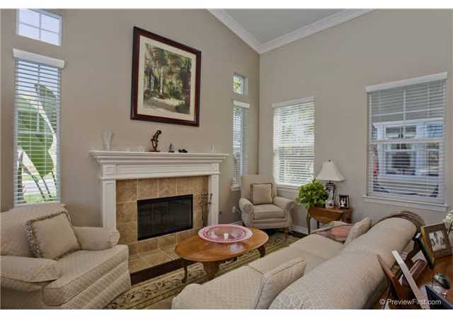 2681 Paradise Road Carlsbad, CA 92009 - Photo 5 of 23 Elegant and peaceful living room area with fireplace and high ceilings. Distressed wide plank flooring added, crown molding and traditional mantel.