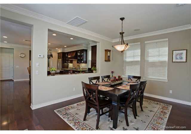 2681 Paradise Road Carlsbad, CA 92009 - Photo 6 of 23 Seller opened wall between kitchen and dining room and made the room more a part of the great room experience. Upgraded chandelier with surround sound installed.